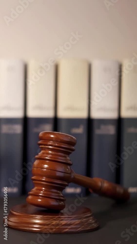 judge mallet gavel in motion with justice books unfocuseds in background , video footage