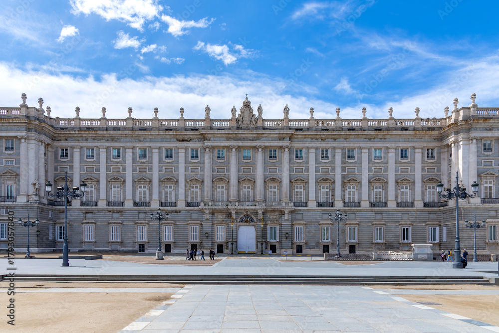 Fototapeta premium Majestic view of Madrid’s Royal Palace, captured from a medium distance, showcasing its grand façade, elegant symmetry, and regal architectural detail, subtle charm