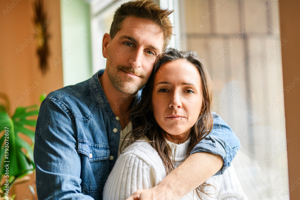 Fototapeta premium Portrait of beautiful couple hug at home