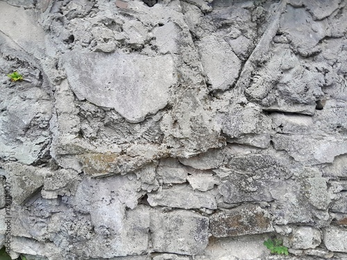 Background of very old stone wall texture photo