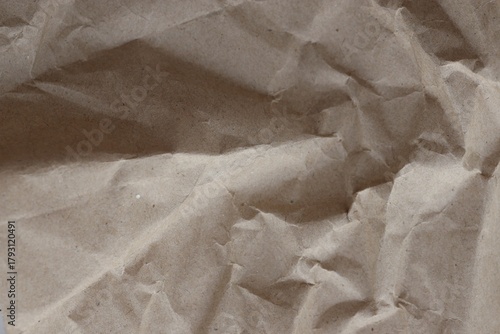 Brown crumpled recycled paper texture background. Kraft Paper