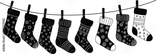 Festive Christmas stockings hanging on a line black and white vector