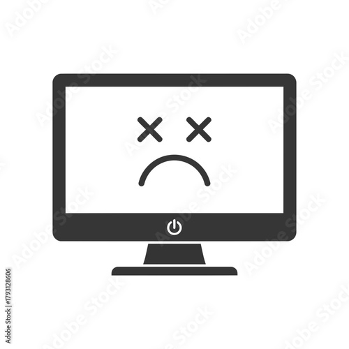 Computer monitor with a sad face and cross eyes on screen, representing a system error or malfunction