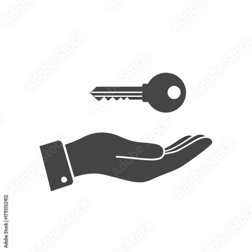 Hand holding a key, symbolizing transfer of ownership, access, or opportunity