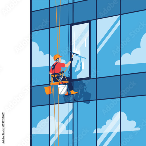 Window washer in a safety harness and helmet using a squeegee to clean the glass facade of a modern high-rise building.