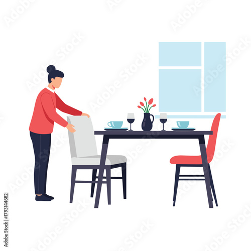 Woman arranging chairs at a beautifully set dining table with flowers and wine glasses in a modern home interior setting.