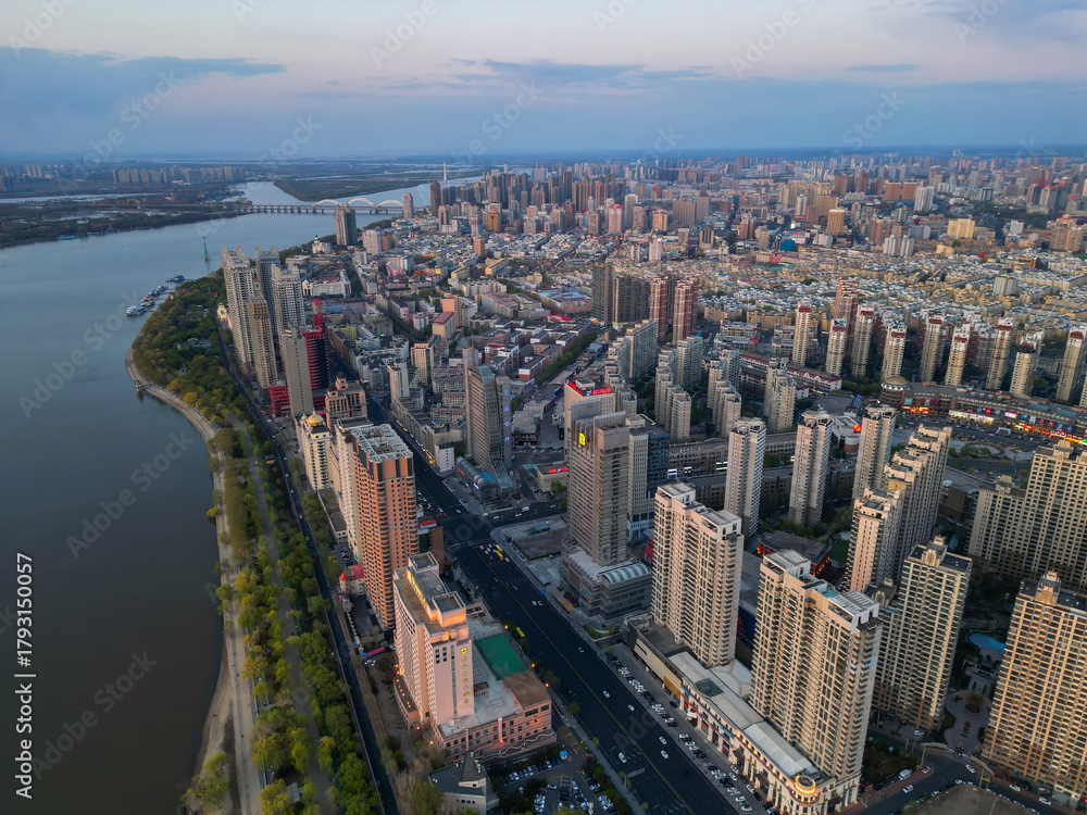 Fototapeta premium Harbin, CHINA-MAY 05, 2025-Aerial cityscape of Harbin's downtown, is the capital of Heilongjiang, China. It is the largest city of Heilongjiang