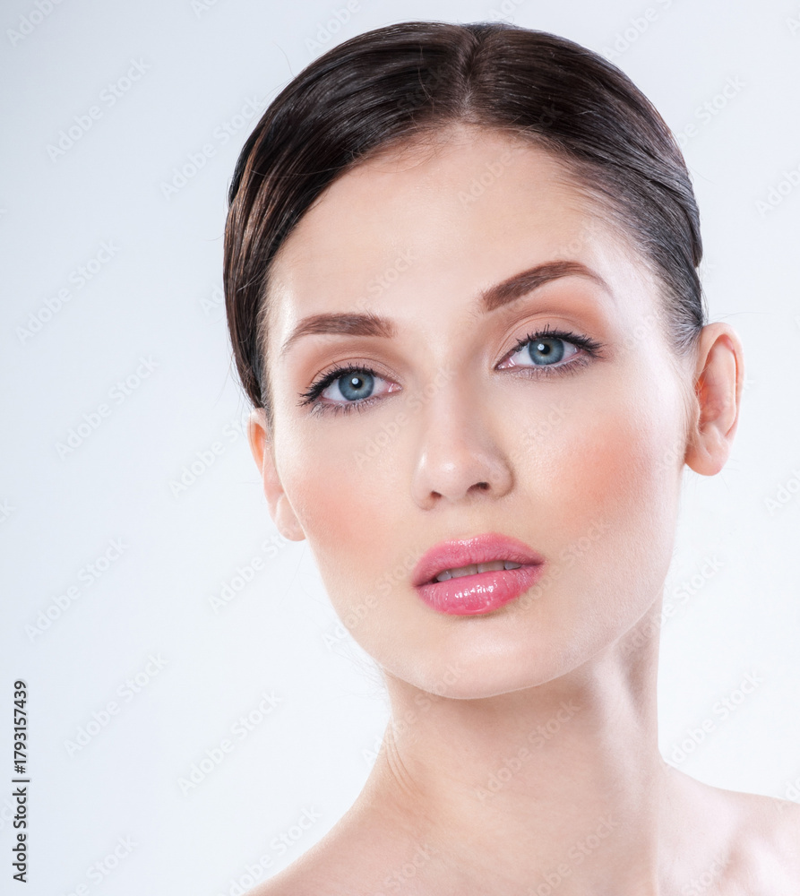 Obraz premium Beautiful face of young adult woman with clean fresh skin. Perfect skin Cosmetology, beauty and spa .