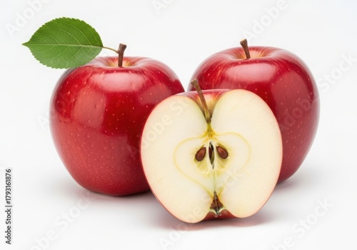 Two red apples and one half apple isolated on white background