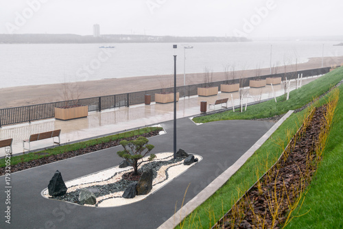 beautiful landscaped garden on the autumn river embankment