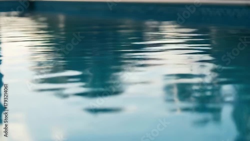 Abstract closeup of water surface with reflections creating blurred patterns