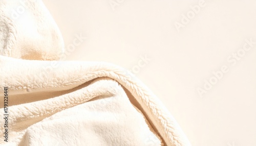 Soft beige fabric folds close-up texture