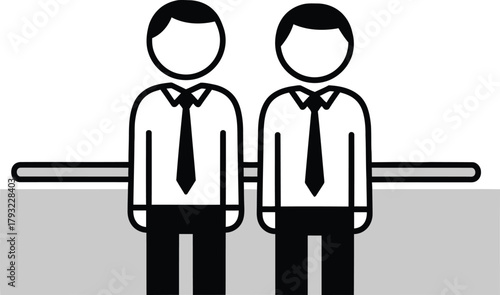 Two stylized business people figures standing side by side on a table representing a foosball game