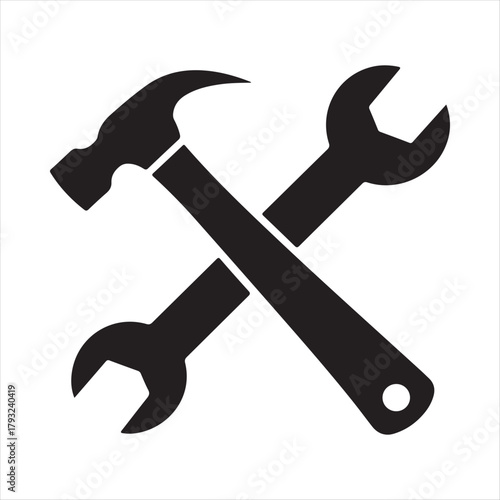 Simple black silhouette icon of a crossed hammer and adjustable wrench representing tools and repair services