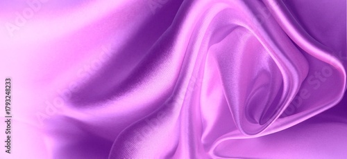 Silk lilac background. Silk fabric, folded in folds.