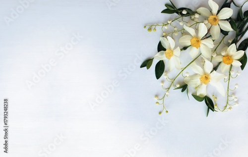 A cheerful bouquet with daffodils on a light background.