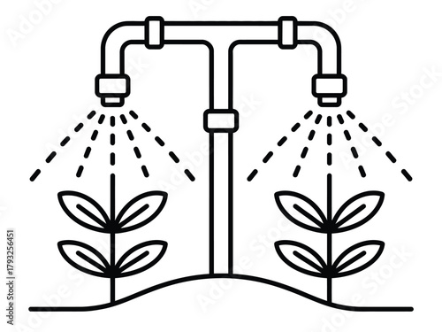 Automated irrigation system waters young plants in a field.