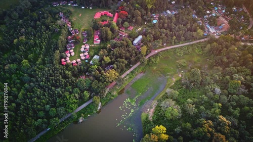 Aerial landscape of the lush green BR Hills near Bangalore, featuring dense forests, rolling hills, and serene water bodies.