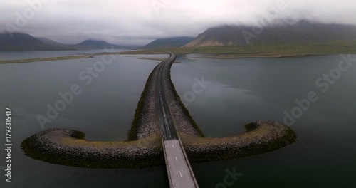 Explore the Iconic Snæfellsnesvegur Bridge in Iceland Through Breathtaking Drone Footage, Showcasing Its Striking Sword-Like Shape, Rugged Coastal Landscapes, and the Majestic Atmosphere of the Nordic