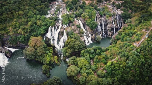 Aerial view of the majestic Shivanasamudra Waterfall, a cluster of cascading falls on the Kaveri River in the Mandya district of Karnataka, India.