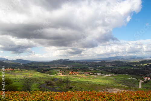 View of the rolling hills of Simi Valley, California, USA with blue skies and white clouds passing overhead.