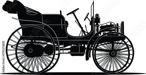 Black silhouette of an antique automobile with large spoked wheels