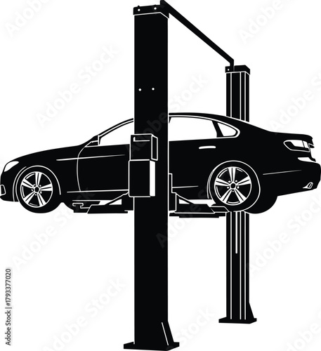 Black silhouette of car on hydraulic lift automobile