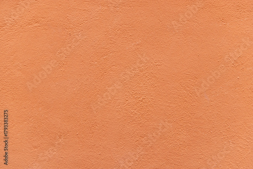 pattern of vintage historic orange painted plaster wall