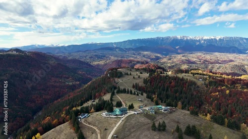 4K Aerial Drone View of Golden Autumn Foliage and Snow-capped Peaks in Moeciu de Sus, Romania