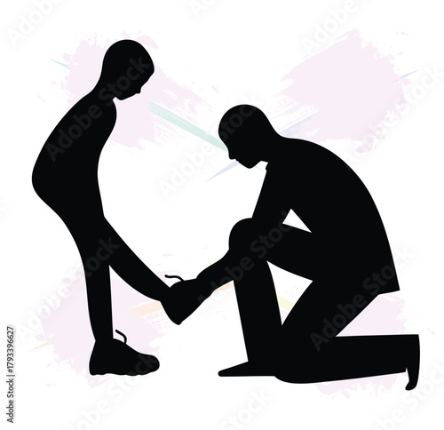 Father tying his sons shoelace a silhouette image of a parent and child bond
