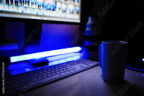 Minimalist workspace with mug / cup and computer keyboard, with Sony Mirrorless Lenses at night. Place for logo at cup / mug