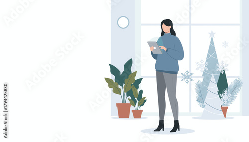 Woman using a tablet indoors during winter holidays surrounded by decorations and plants