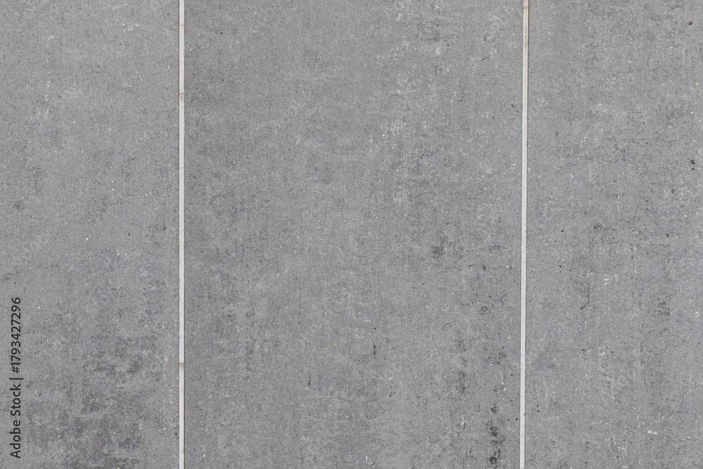 Fototapeta premium Gray Concrete Tiles Forming Minimalist Pavement Background