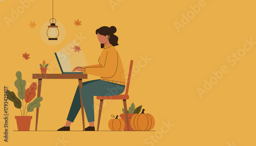 Remote work concept Woman typing on laptop at home desk surrounded by fall decoration