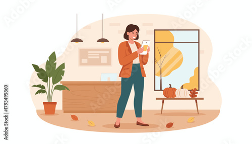 A happy woman uses a tablet in an autumnal office lobby or modern workspace