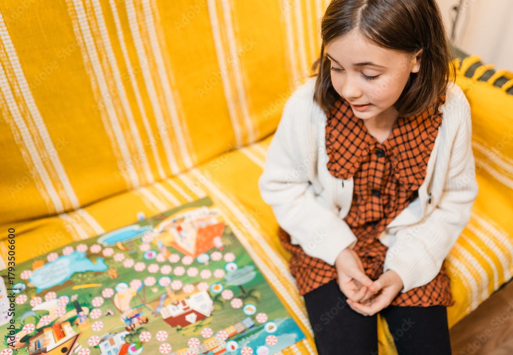 Fototapeta premium Happy father and child playing board game at home - happiness and family concept.