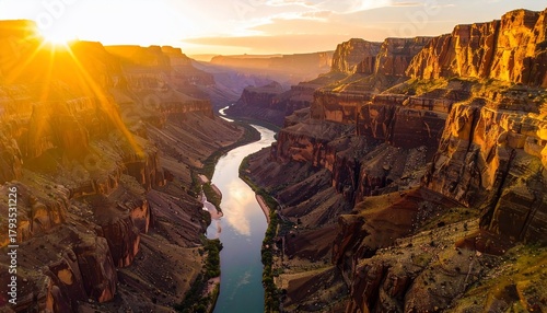 Stunning aerial vista of a sunlit canyon with a river flowing through the landscape