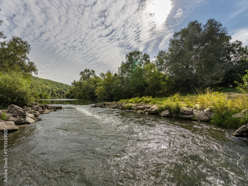 River with a cloudy sky in the background