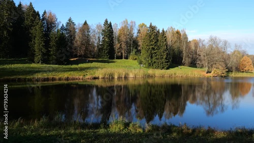 Panorama of Krugloye Lake in the landscape Pavlovsk Park on a sunny autumn day, suburb of St. Petersburg, Russia