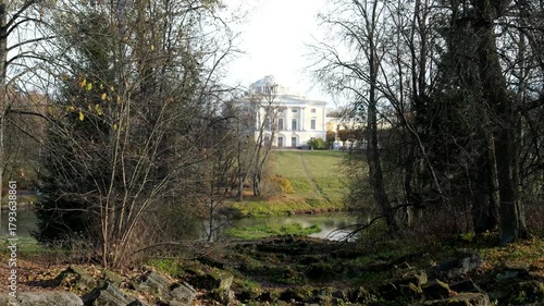 Pavlovsk Palace at top of green slope from the side of Apollo colonnade on an autumn day, 18th-century Russian Imperial residence, suburb of St. Petersburg, Russia