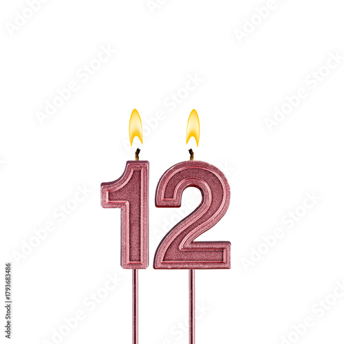 Lit birthday candle - Candle number 12 on white background