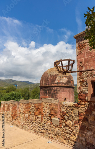 Exterior view of Castelldefels Castle, a 10th-century fortress on a sunny summer day