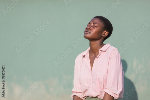 crying girl with tearstreaked cheeks stands against clean solid background her eyes reflecting deep emotion