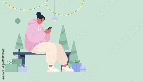 Woman using phone in festive winter setting with gifts and string lights Holiday communication concept