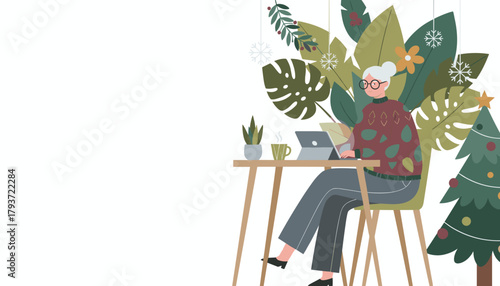 Remote working senior woman typing on tablet in a cozy festive home office with tropical plants