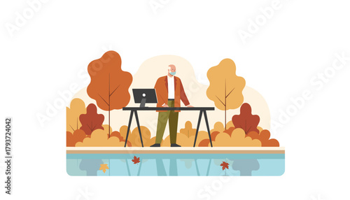 Elderly man works remotely in autumn nature at a modern standing desk Flexible work