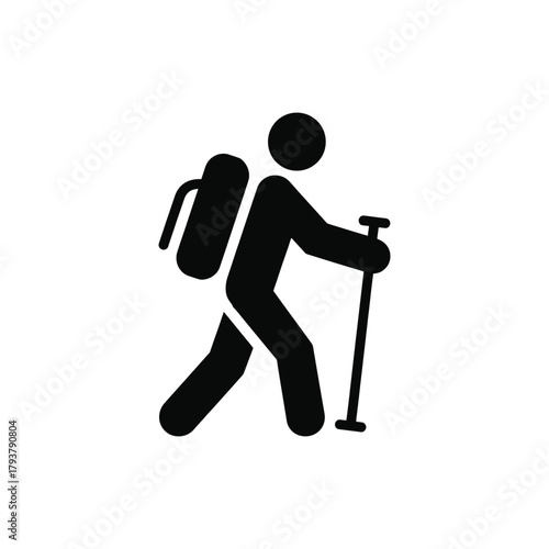 A person with a backpack and walking stick