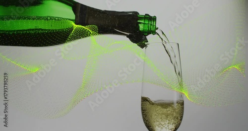 Tilting green bottle pouring into flute while neon green wave sweeping, showing bubbles rising