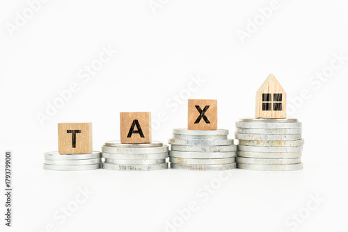 Property Tax Concept with Wooden Blocks and Coins