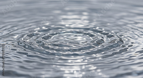 Abstract ripples create a mesmerizing water surface, showcasing fluid dynamics and light reflection, with concentric circles forming a captivating pattern of waves and subtle shadows, it evokes